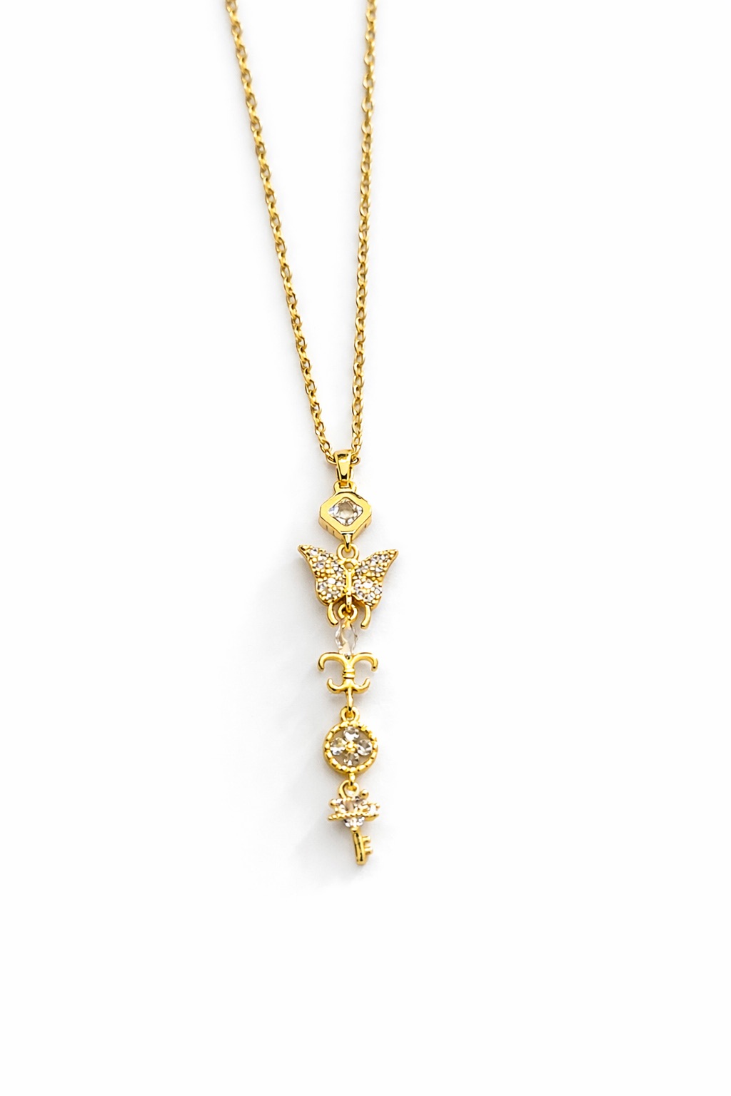 Çoklu Figürlü Zirkon Taşlı Altın Renk Uzun Çelik Kolye